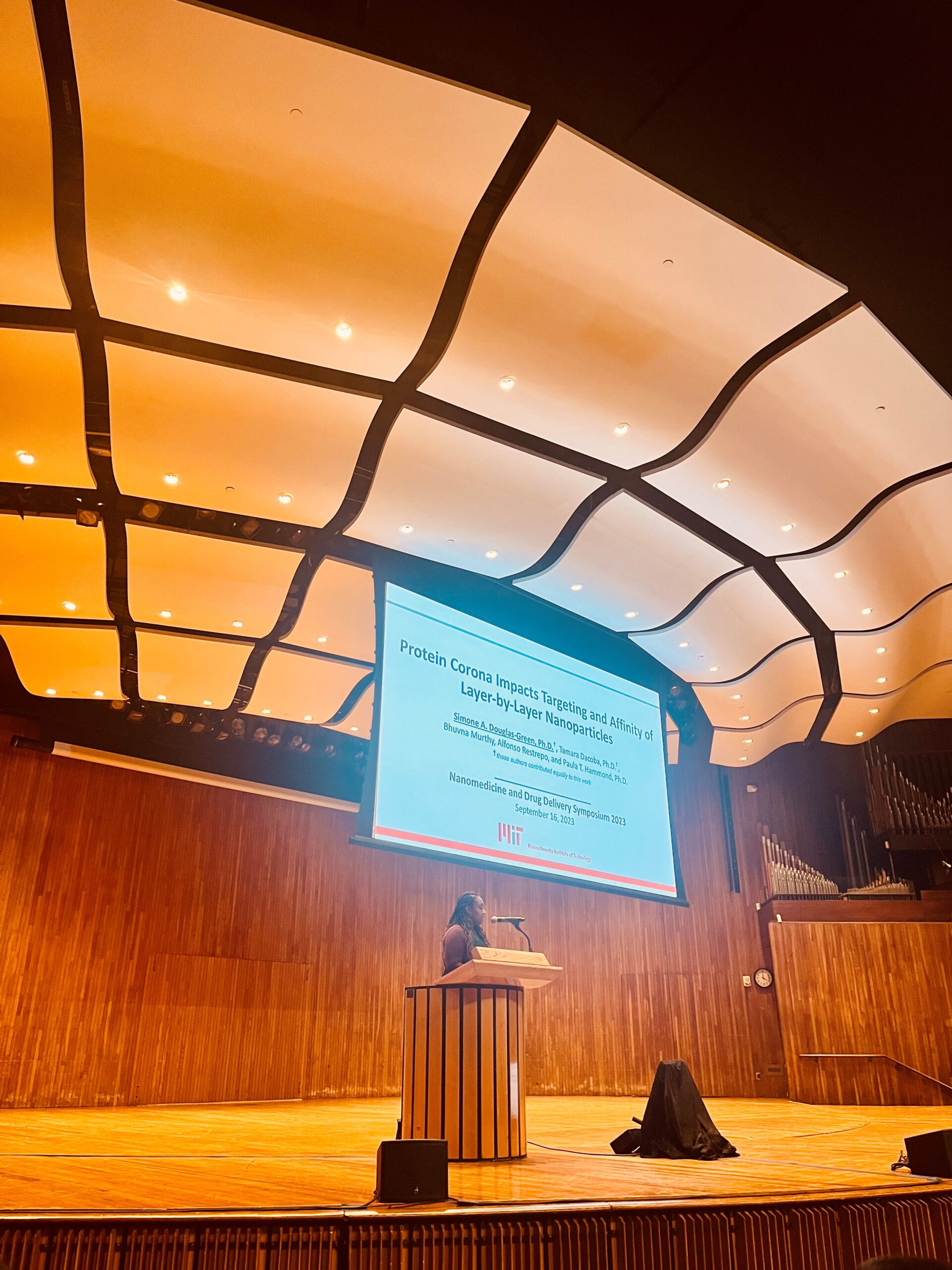 Postdoc Simone Douglas-Green presents her research after winning a best poster award at nanoDDS 2023.